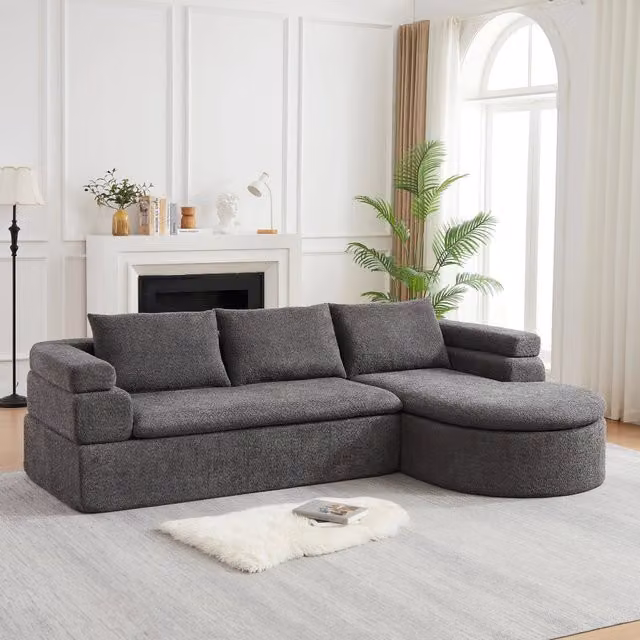 Divano angolare con chaise longue in chenille con bracciolo a gradini e schienali imbottiti grigio antracite