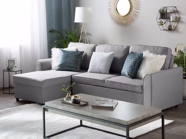 Divano letto ad angolo Beliani in tessuto grigio con contenitore e orientamento a destra L 228 cm x P 145 cm x H 84 cm – 1
