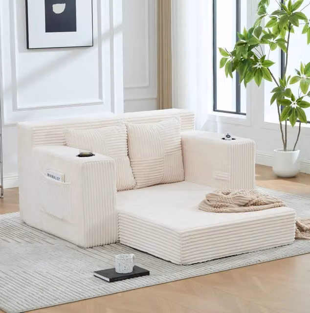 Divano pouf in velluto a coste beige con tasche laterali; 2 cuscini; 151 x 133 x 64 cm