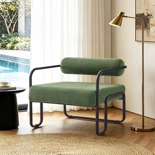 Poltrona lounge Mivray in cord verde con struttura in metallo nero opaco e schienale cilindrico