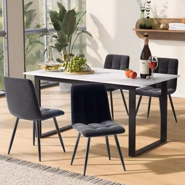 Set da pranzo moderno: tavolo 140/180x80x75 cm con piano in MDF bianco e gambe nere, 4 sedie in velluto grigio