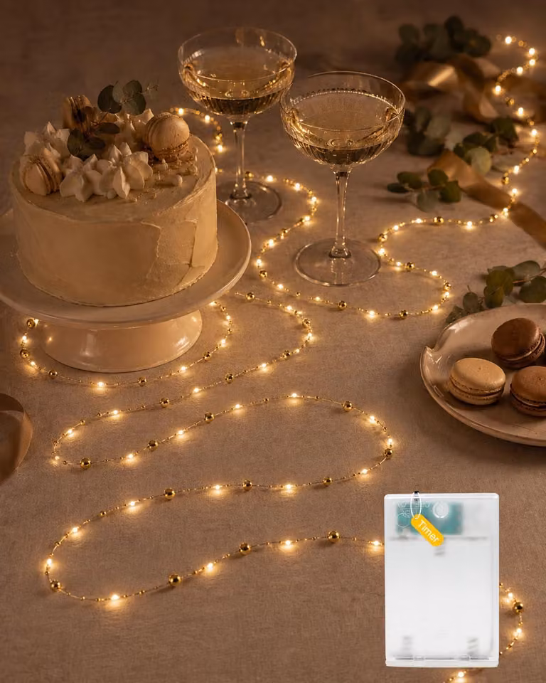Catena luminosa a forma di perle, 5 metri, 50 LED, color oro, con timer, alimentata a batteria