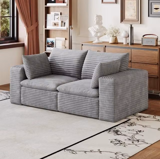 Divano modulare in tessuto grigio con imbottitura in schiuma; design componibile