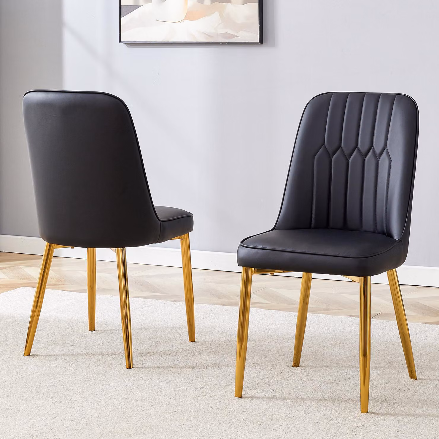Set di 2 sedie da pranzo, rivestite in ecopelle, con seduta allargata, schienale e gambe in metallo (colore nero e oro)