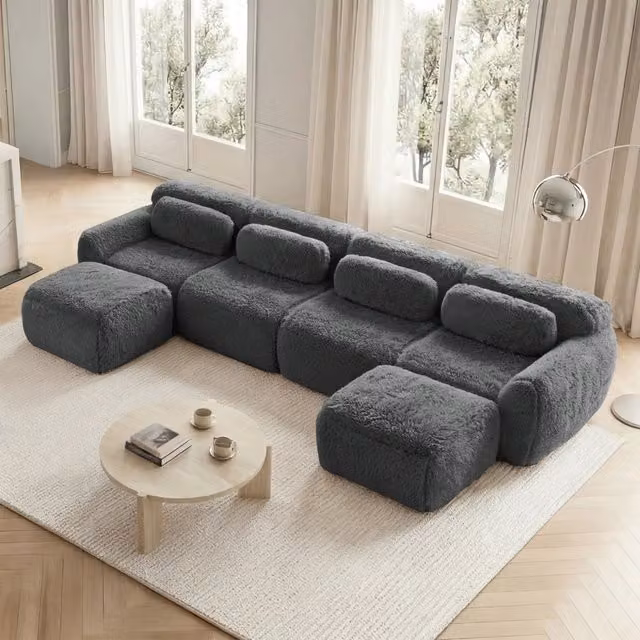 Divano modulare a U senza montaggio in tessuto peluche con pouf collegabile base antiscivolo e cuscini grigio