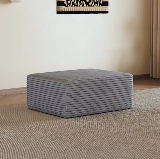 Ottomana modulare MODFU in tessuto grigio con design minimalista