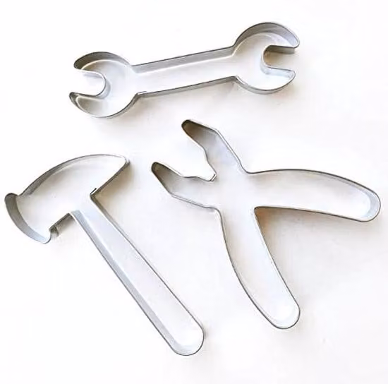Set di mini utensili da cucina in acciaio inossidabile a forma di biscotto.