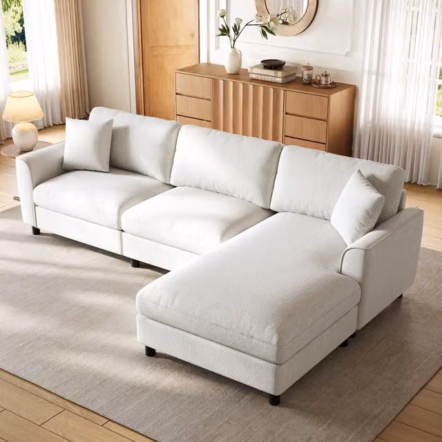 Divano angolare reversibile in cheniglia beige con ampia seduta distesa; 256x137x79 cm