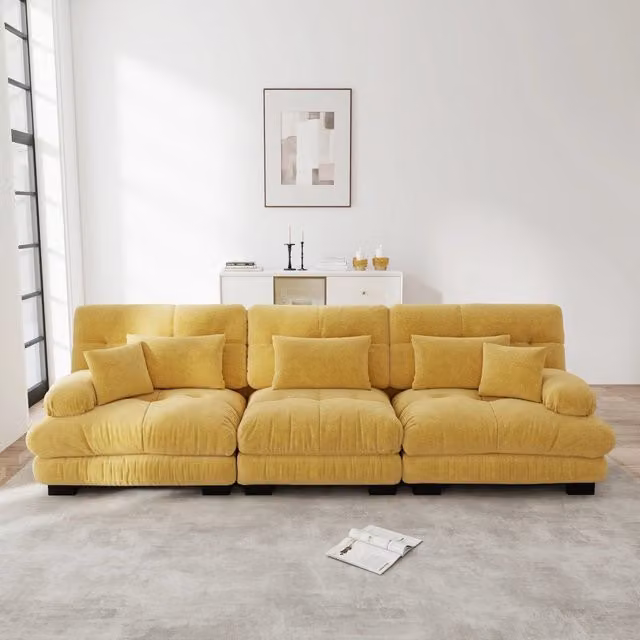Divano angolare modulare MIVRAY in tessuto giallo con cuscini decorativi per soggiorno e studio
