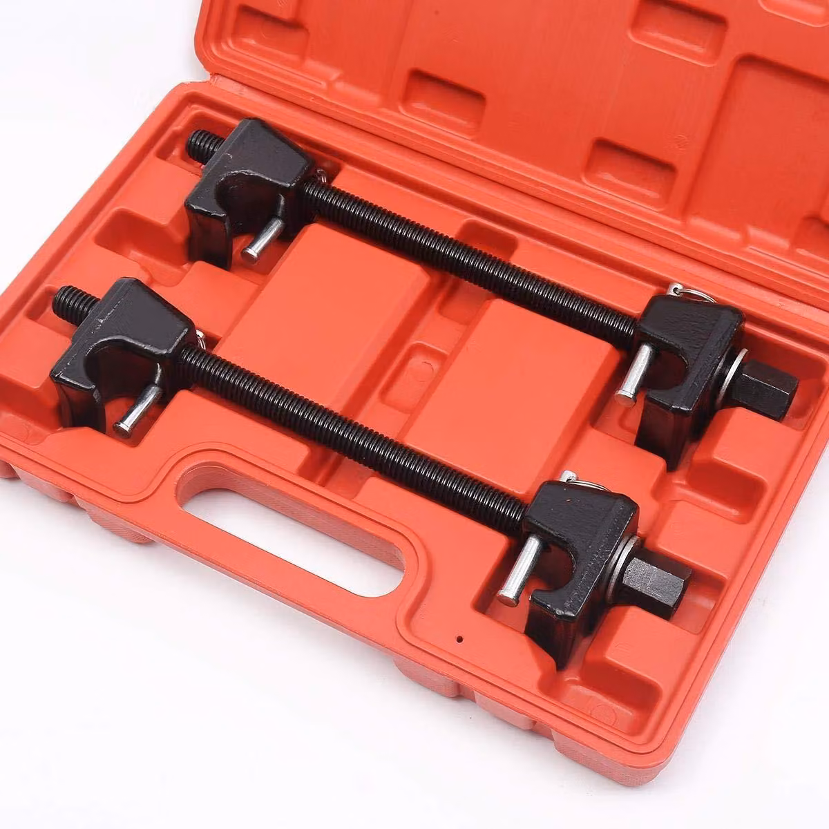 Compressore per molle elicoidali con spine di sicurezza, per automobili