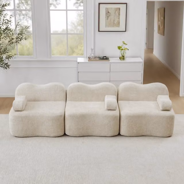 Divano modulare senza struttura in velluto con seduta profonda e cuscini bracciolo mobili per soggiorno beige