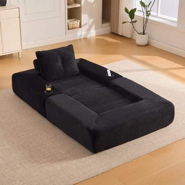 Divano convertibile in velluto a coste con molle, cuscini in memory foam, tasche laterali e portabicchieri nero
