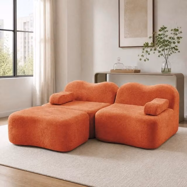 Divano angolare modulare MIVRAY in velluto arancione con pouf coordinato e seduta profonda per il tuo soggiorno moderno