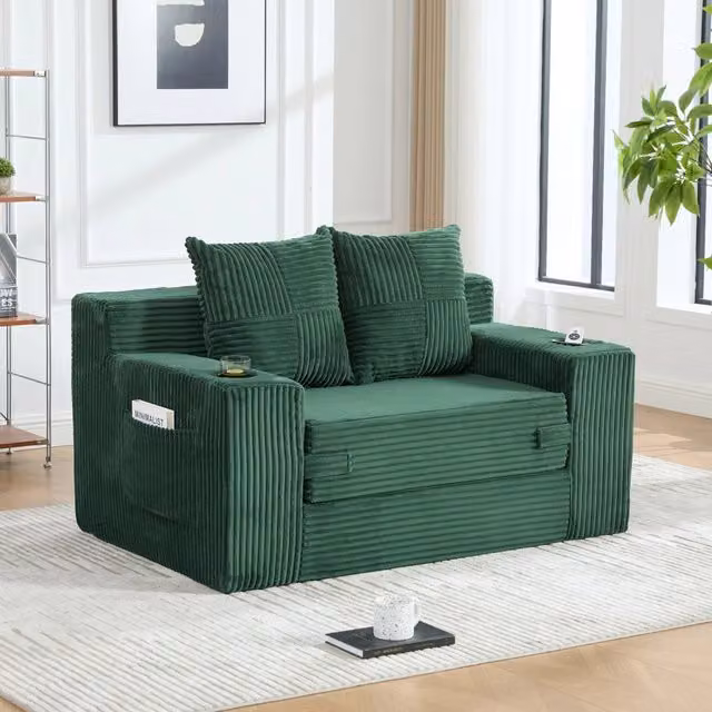 Divano pouf 151x133x64 cm con tasche laterali in velluto a coste smeraldo