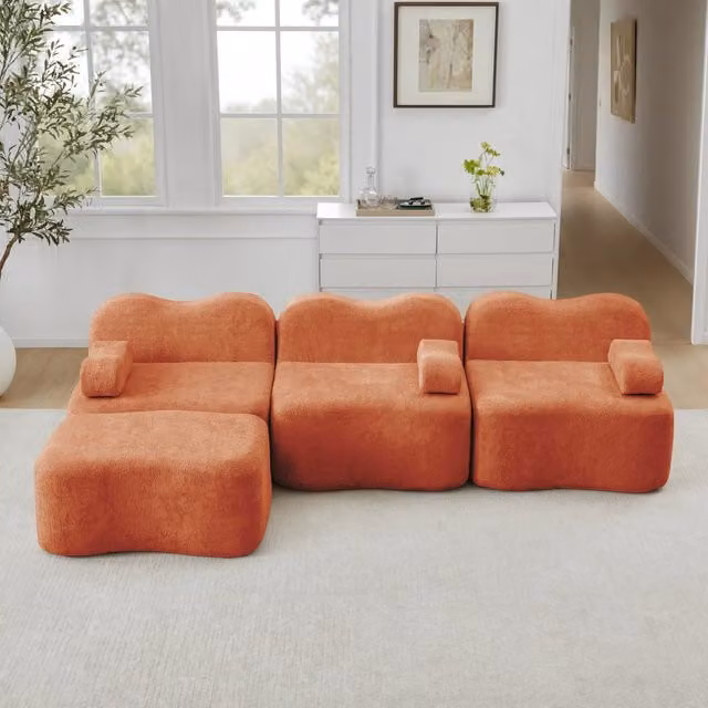 Divano angolare modulare senza struttura con pouf collegabile e seduta profonda in velluto arancione