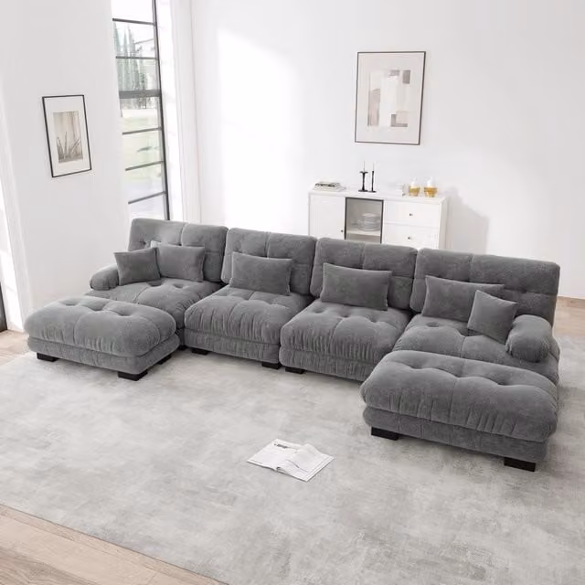 Divano modulare ad angolo a U OKWISH da 4 posti in tessuto grigio con pouf e cuscini decorativi per il tuo soggiorno