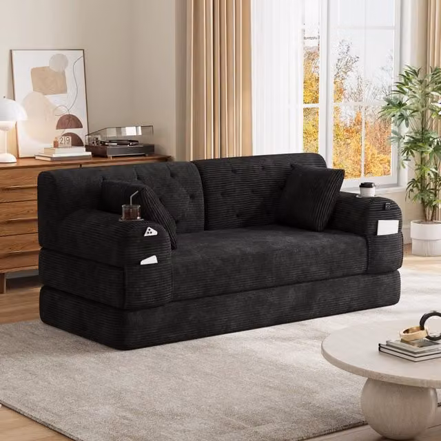 Divano letto 168x80x81 cm con schienale alto; 4 tasche e 2 portabicchieri in velluto a coste nero
