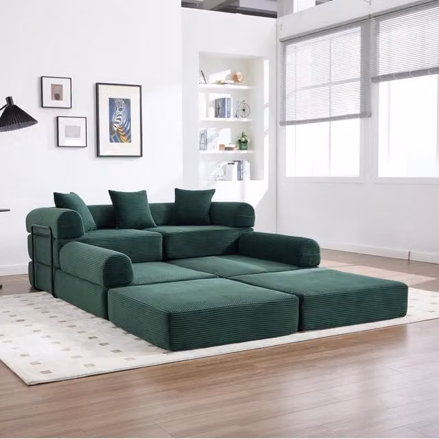 Divano modulare con funzione letto MIVRAY in velluto a coste verde smeraldo con forma a L e tasca laterale
