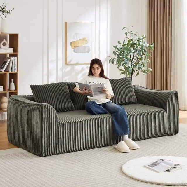 Divano modulare OKWISH in velluto a coste verde con due cuscini e seduta ampia in schiuma