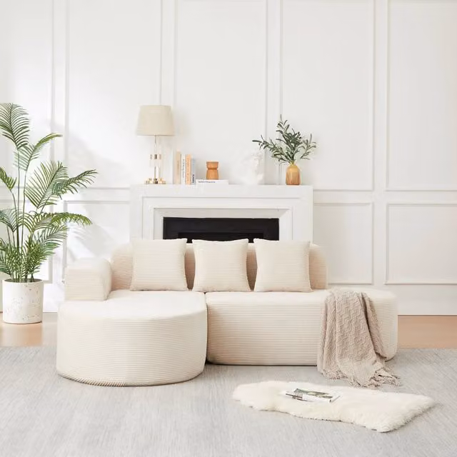 Divano a L con chaise longue curva in velluto a coste beige