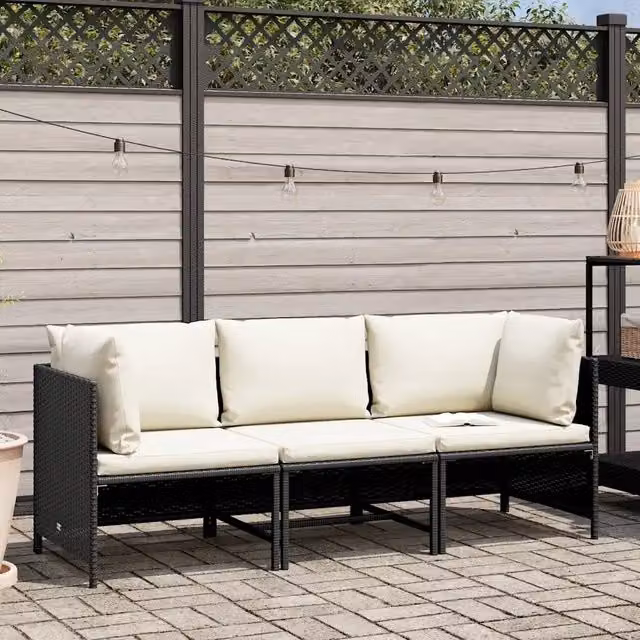Divano da giardino a L Design Mania in rattan nero con cuscini rimovibili e struttura in acciaio verniciato a polvere