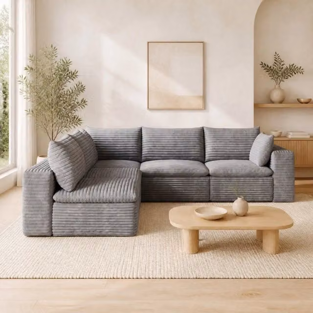 Divano modulare in tessuto grigio con supporto in schiuma; design componibile e imbottitura morbida