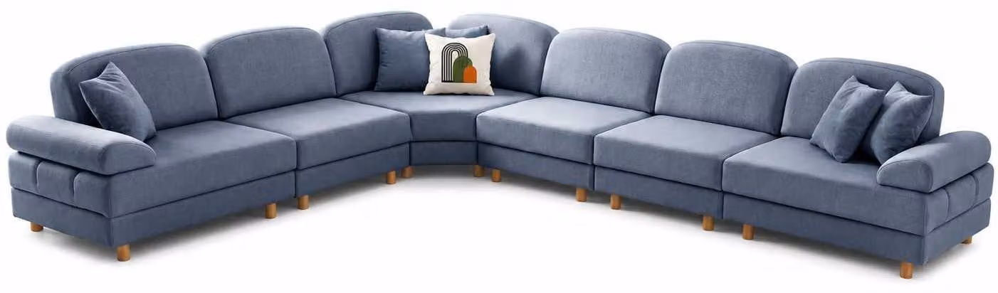 Divano ad angolo a forma di L, rivestito in tessuto blu, dal design moderno, con ampi spazi di seduta, ideale per il soggiorno e pensato per il comfort
