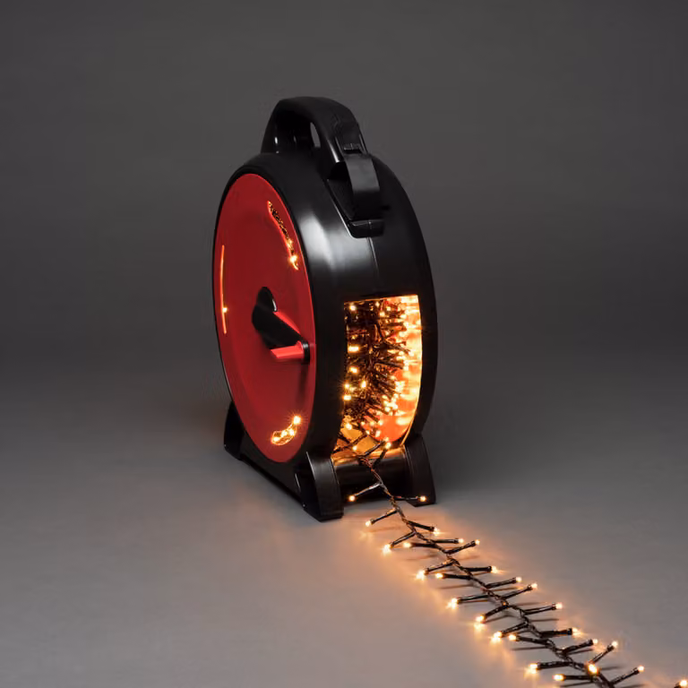 Konstsmide Micro LED Compactlights con avvolgicavo, 1200 diodi color ambra, 30V, per esterni (IP44), cavo nero - 3850-800