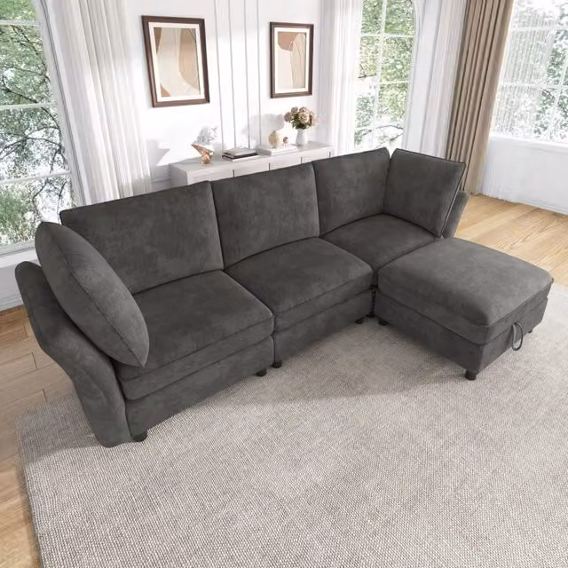 Divano modulare a L 225x137x84 cm con pouf contenitore in chenille grigio