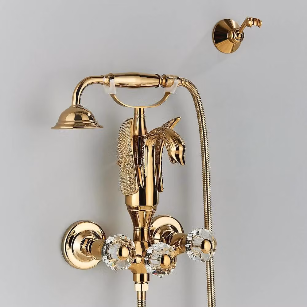 Rubinetteria per vasca da bagno - Modello a cigno indipendente - Tre maniglie con finitura cristallo - Doccetta in ottone - Cartuccia in Vetroceramica - Corpo in acciaio inossidabile 304 - Oro
