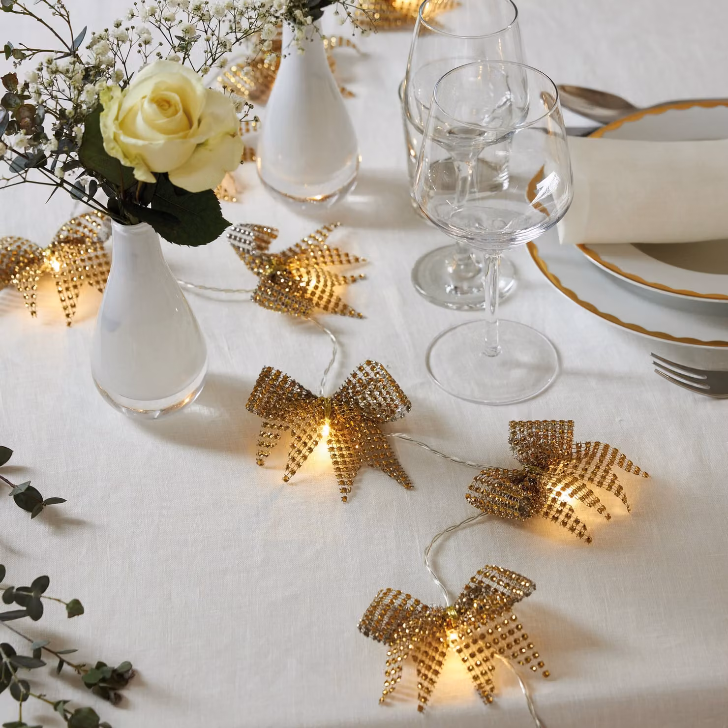 Ghirlanda luminosa decorativa a batteria «Bowie», 20 fiocchi in tessuto dorato, LED, timer, luce bianco caldo, L 200 cm