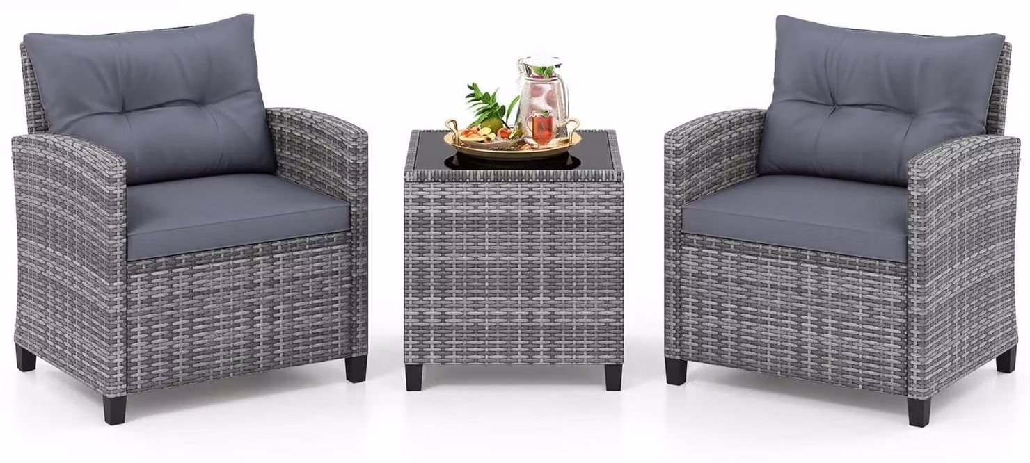 Set da giardino in rattan composto da 3 pezzi con cuscini e tavolo in vetro.