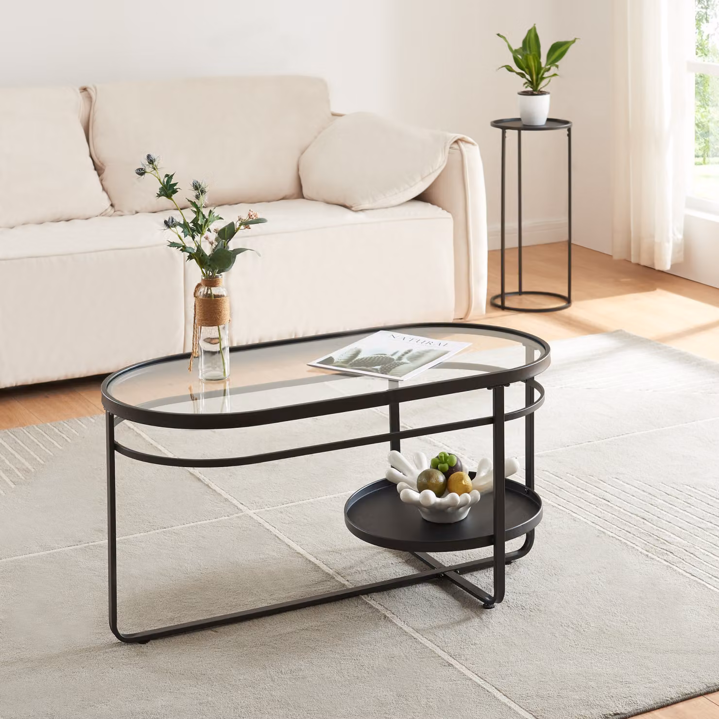 Tavolino 'Kumla' struttura ovale in metallo con piano in vetro 90 x 42,5 x 46 cm nero