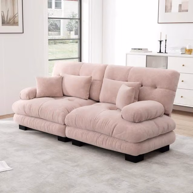 Divano modulare a L MODFU in tessuto rosa con cuscini decorativi inclusi