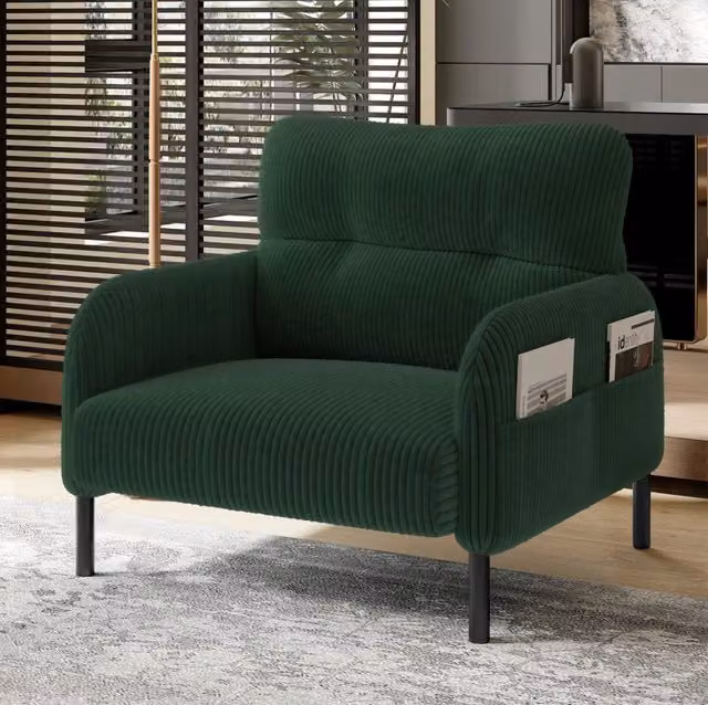 Poltrona singola in velluto di cotone con seduta profonda, tasche laterali e struttura metallica, adatta per soggiorno, camera da letto e studio
