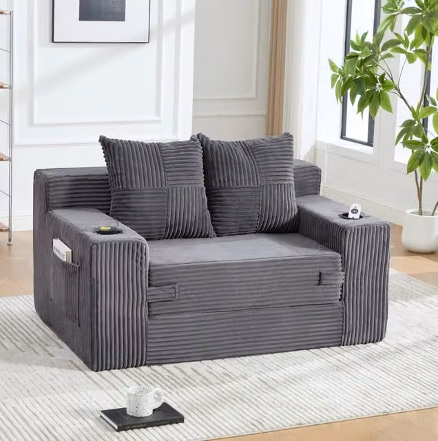 Divano pouf in velluto a coste grigio con tasche laterali e 2 cuscini; 151 x 133 x 64 cm