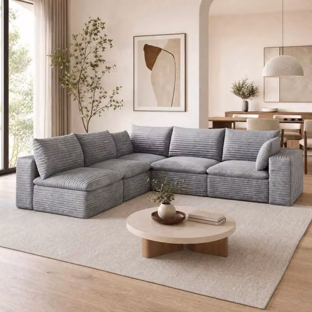 Divano modulare in tessuto grigio con imbottitura in schiuma e configurazione versatile