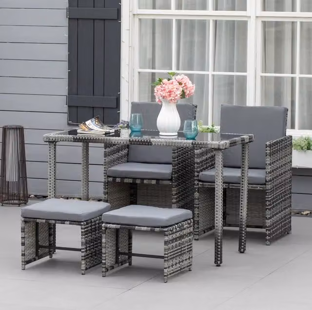 Set da pranzo da giardino 5 pezzi in polyrattan grigio con tavolo in vetro e cuscini