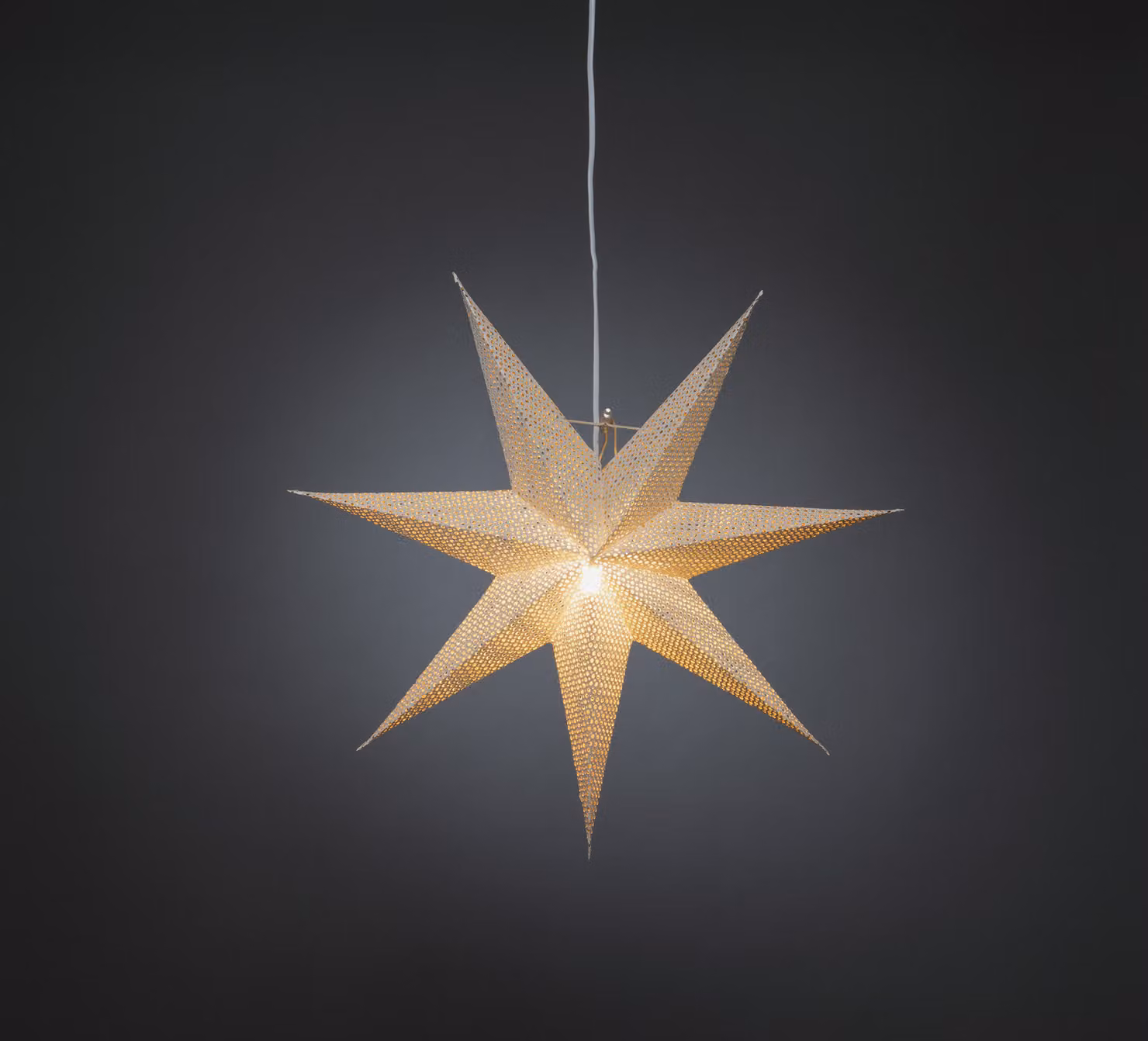 Stella di carta bianca, perforata, interno color ottone