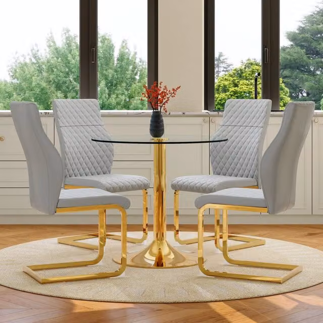 Set da pranzo Mivray composto da tavolo rotondo in vetro trasparente e 4 sedie in PU grigio con dettagli oro e base in metallo