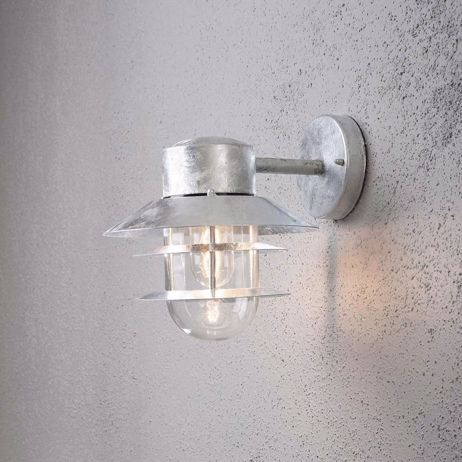 Applique Konstsmide Modena in acciaio galvanizzato con vetro trasparente