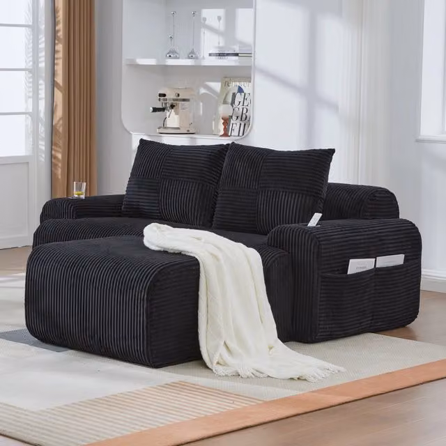 Divano modulare REDOM a 2 posti in velluto a coste nero con pouf coordinato L: 200 cm, P: 174 cm, H: 80 cm