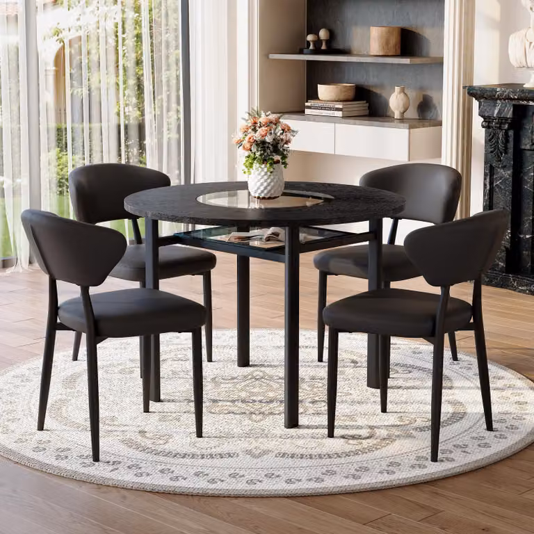 Set tavolo da pranzo rotondo STILVORA con 4 sedie in materialePoliuretanoe schienale confortevole. Tavolo rotondo di 100 cm con finitura effetto legno nero. Set da pranzo per soggiorno, colore nero