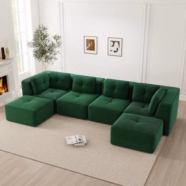 Divano angolare modulare OKWISH in velluto a coste verde con base antiscivolo e braccioli ampi