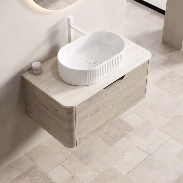 Mobile sottolavabo sospeso con lavabo in ceramica e cassetto a chiusura ammortizzata con piano in pietra sinterizzata