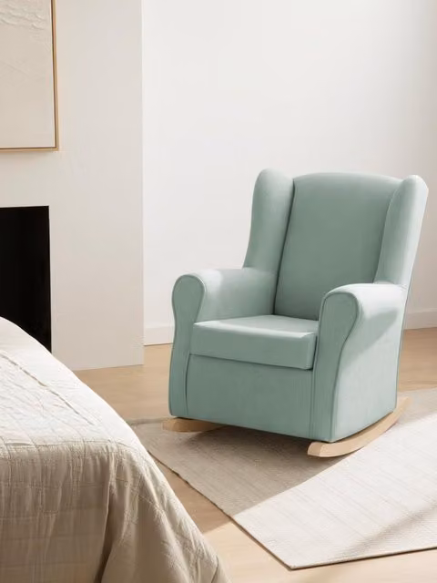 Poltrona a dondolo Hilde rivestita in tessuto verde Kenay Home