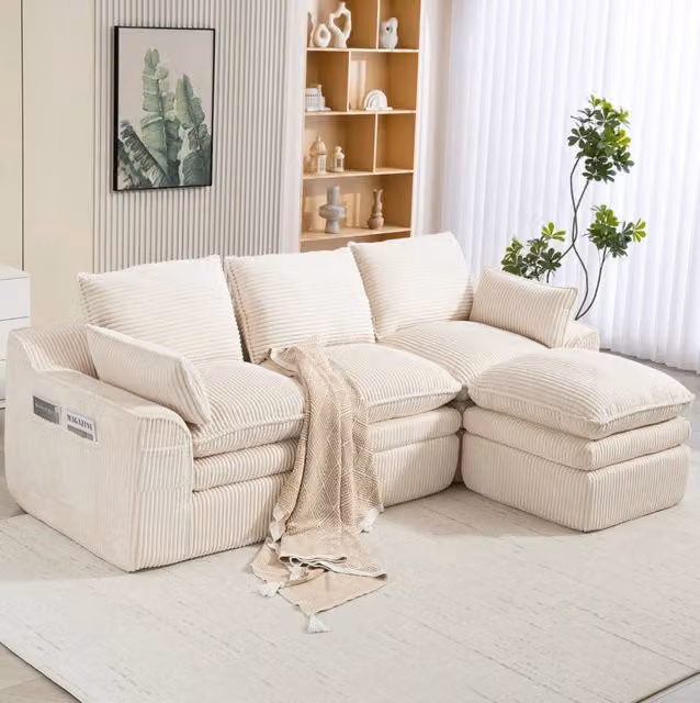 Divano modulare in velluto a coste beige con pouf; tasche laterali e cuscini; 263 x 167 x 85 cm