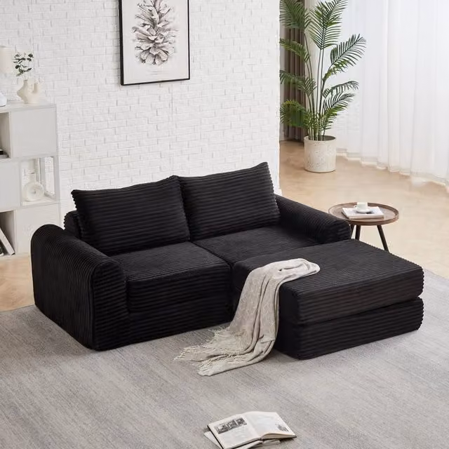 Divano letto modulare con pouf rimovibile e braccioli curvi, configurazione flessibile in velluto a coste nero