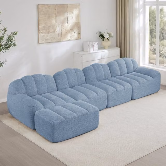 Divano modulare a L Zephmum con pouf coordinato, rivestimento in tessuto blu e schiuma ad alta densità, L/P/H: 244 x 165 x 79 cm