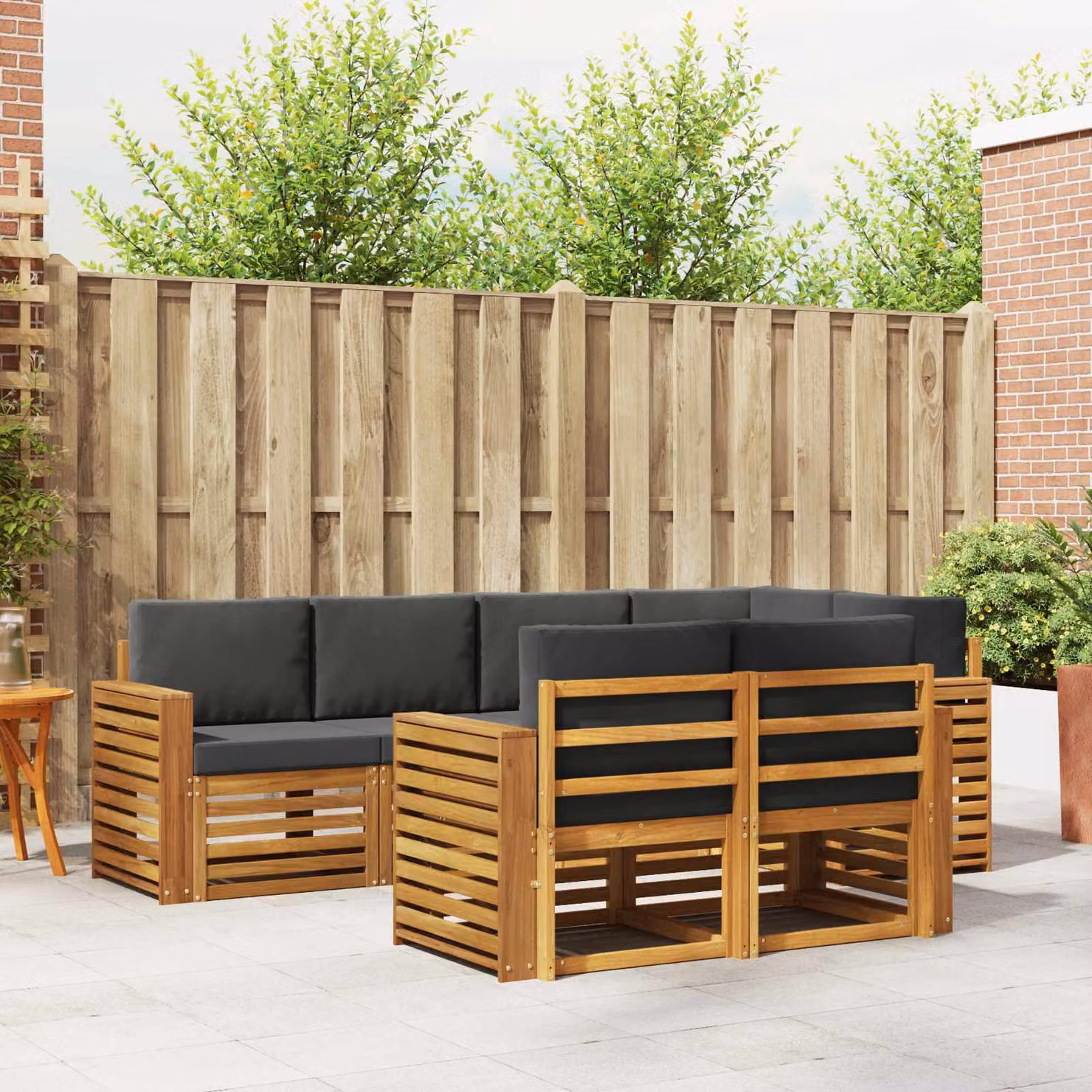 vidaXL Set di divani da esterno a L composto da 7 pezzi in legno di acacia con cuscini beige e antracite